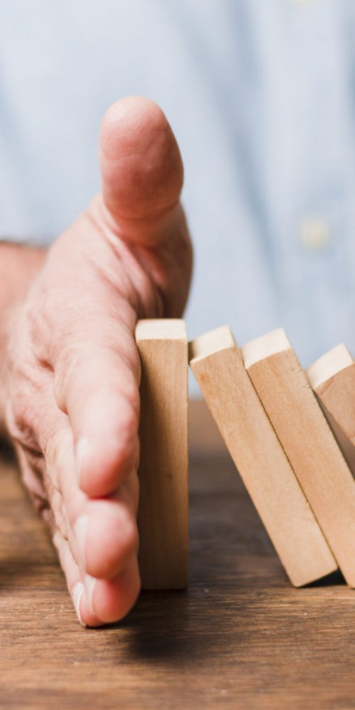 businessman-using-wooden-pieces